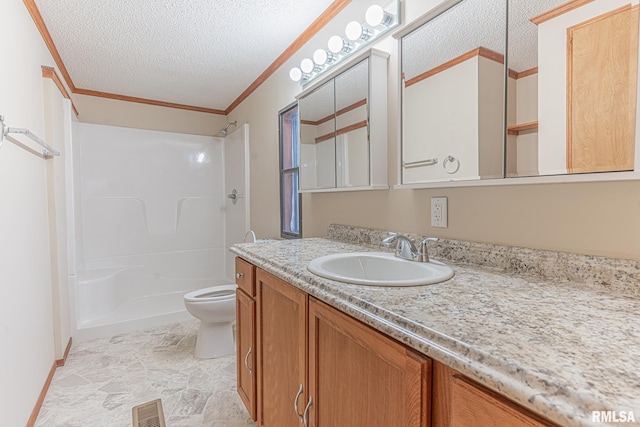 full bathroom with vanity, crown molding, a textured ceiling, and toilet