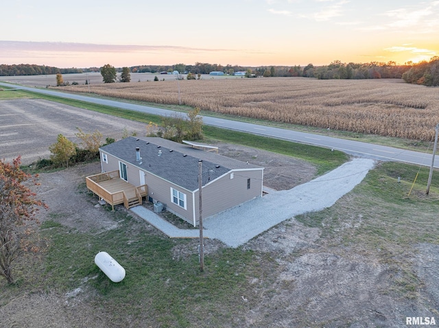 aerial view at dusk featuring a rural view