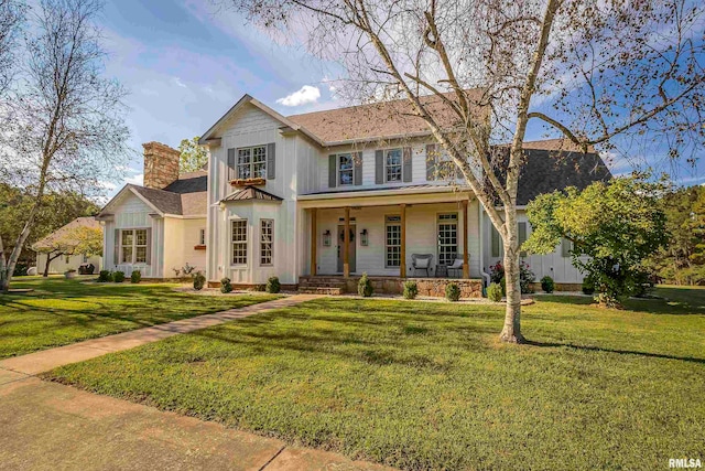 view of front of home featuring a porch and a front yard