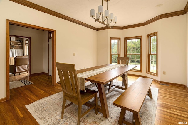 5345 State Route 127th Hwy, Cobden, IL 62920 - dining area with a chandelier, baseboards, wood finished floors, and crown molding