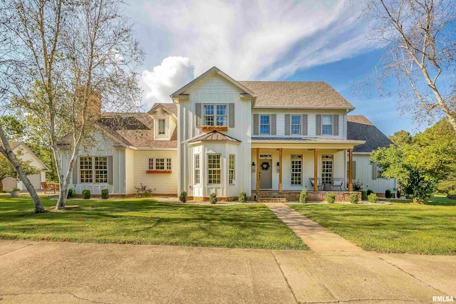 view of front of property with a front lawn and a porch