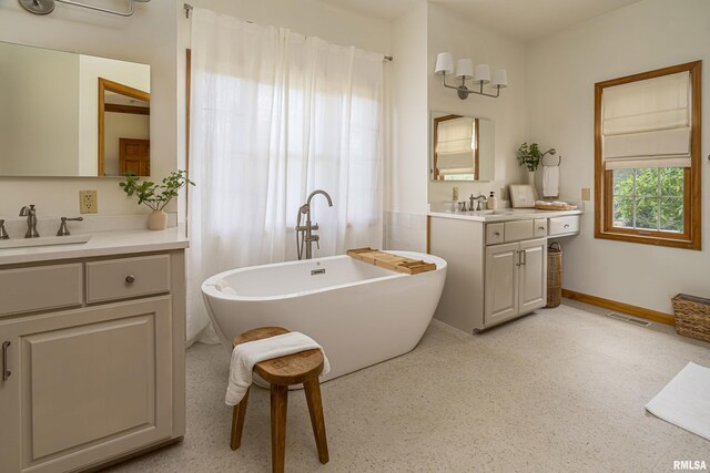 5345 State Route 127th Hwy, Cobden, IL 62920 - full bath with two vanities, a freestanding tub, and baseboards