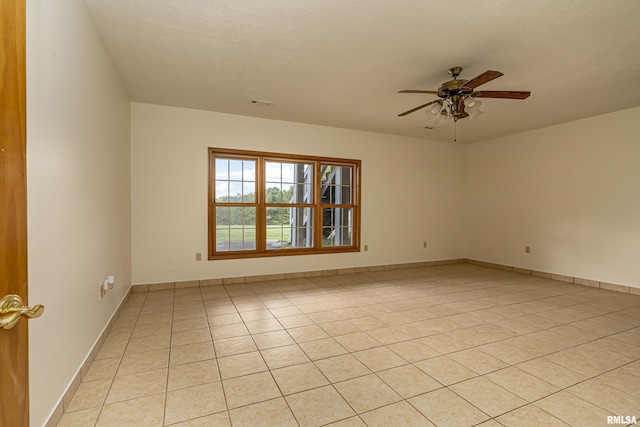 5345 State Route 127th Hwy, Cobden, IL 62920 - empty room featuring light tile patterned floors, a ceiling fan, and baseboards