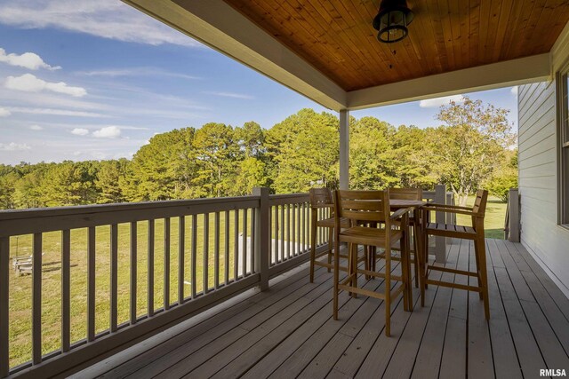 5345 State Route 127th Hwy, Cobden, IL 62920 - wooden deck featuring a lawn, outdoor dining space, and a wooded view