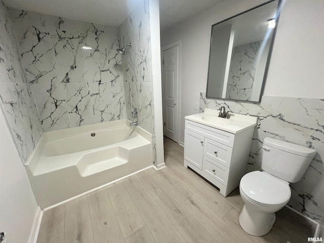 bathroom with wood walls, toilet, and sink