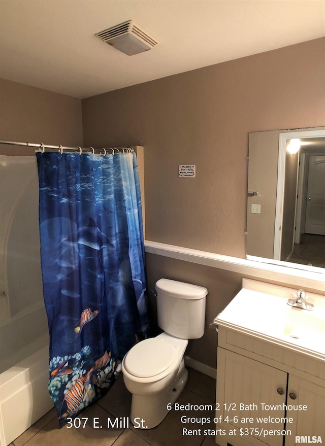 full bathroom featuring vanity, shower / bathtub combination with curtain, toilet, and tile patterned floors