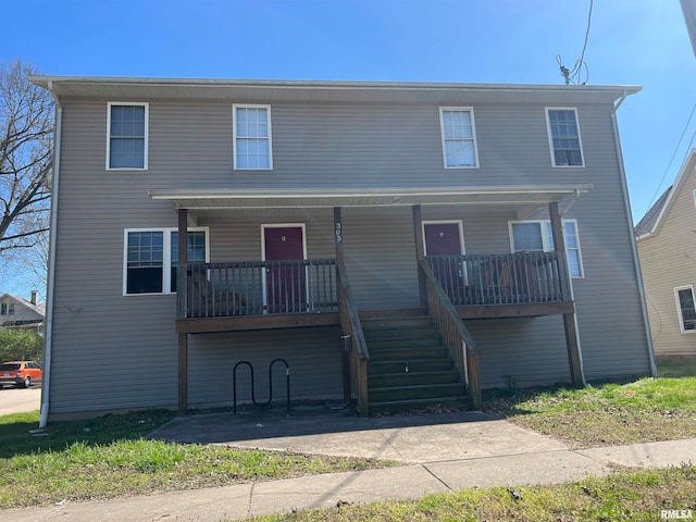 view of property featuring a porch