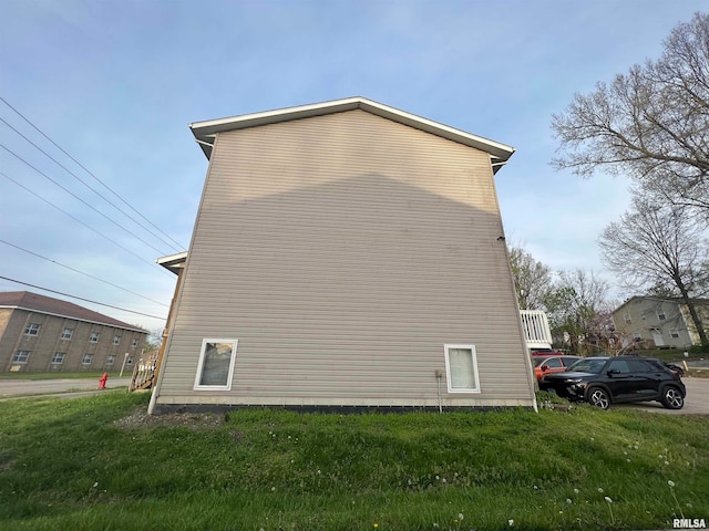 view of property exterior featuring a yard