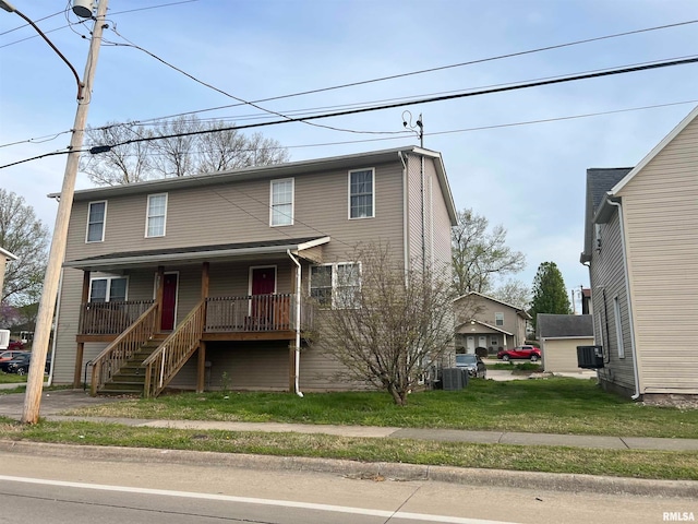 view of front of property with central AC and covered porch