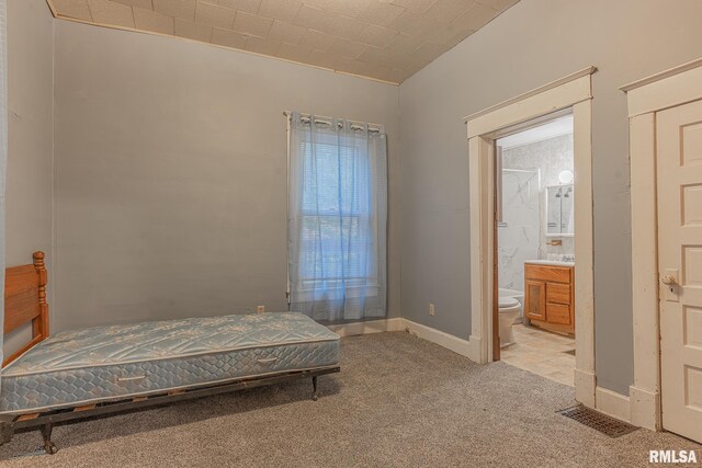 727 N Broadway Ave, Salem, IL 62881 - bedroom with light colored carpet, ensuite bathroom, and baseboards