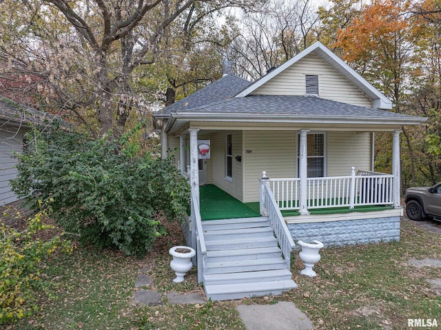 727 N Broadway Ave, Salem, IL 62881 - view of front of house with covered porch and a shingled roof