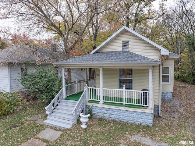 727 N Broadway Ave, Salem, IL 62881 - view of front of home featuring covered porch and roof with shingles