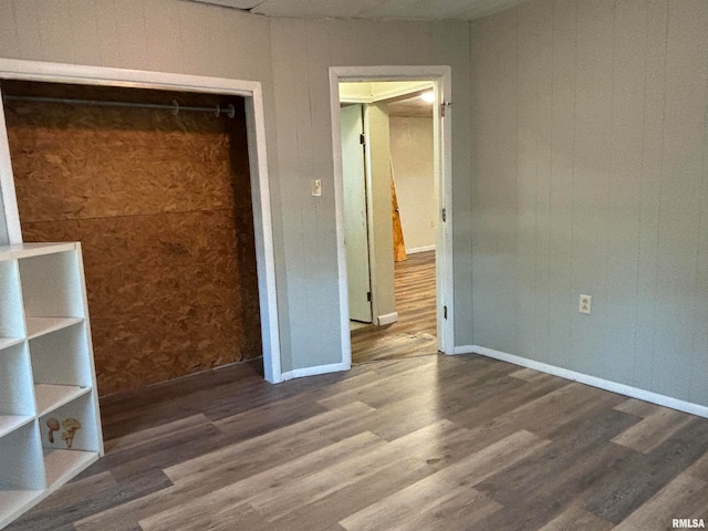 unfurnished bedroom featuring dark hardwood / wood-style floors