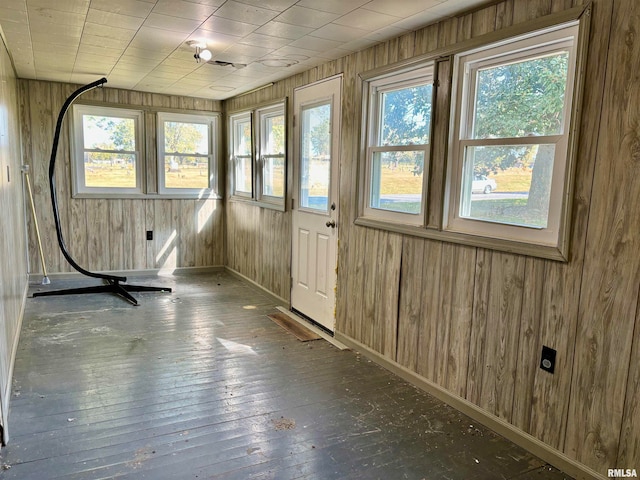 unfurnished sunroom featuring a wealth of natural light