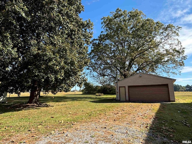 garage featuring a yard