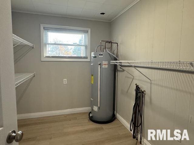 utility room featuring electric water heater