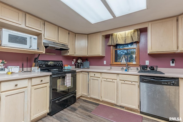 kitchen featuring black / electric stove, light brown cabinetry, dishwasher, light hardwood / wood-style floors, and sink