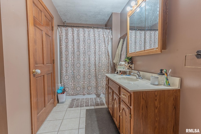 bathroom featuring vanity, tile patterned floors, and a shower with shower curtain