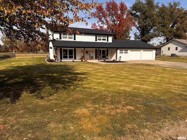 view of front of house with a front lawn and a garage