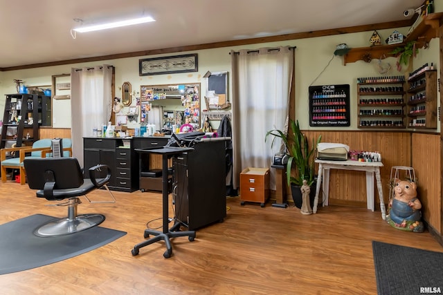 office space featuring wooden walls and hardwood / wood-style floors