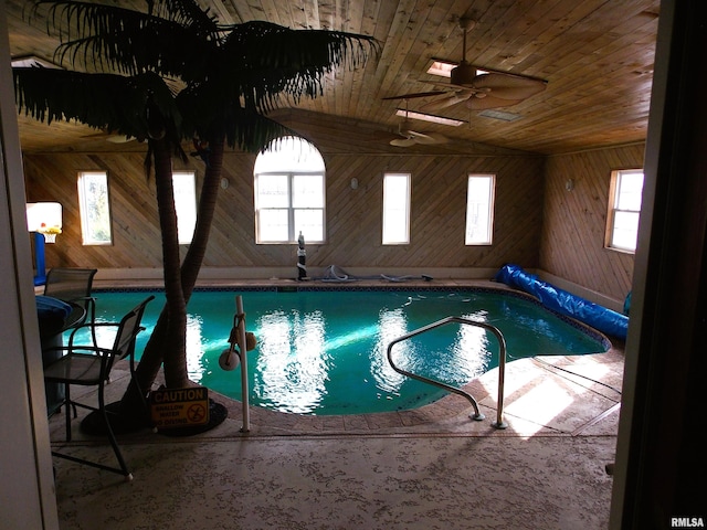 view of swimming pool featuring a hot tub