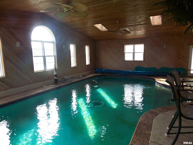 view of swimming pool with a skylight