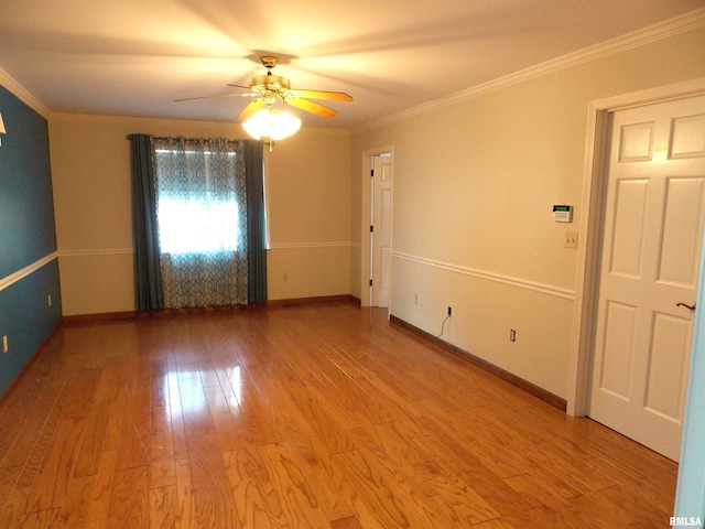 spare room with light hardwood / wood-style floors, ornamental molding, and ceiling fan