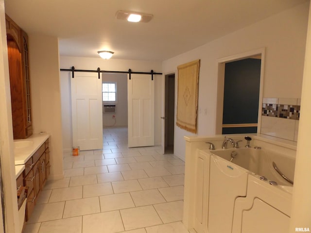 bathroom featuring vanity, a tub to relax in, cooling unit, and tile patterned flooring