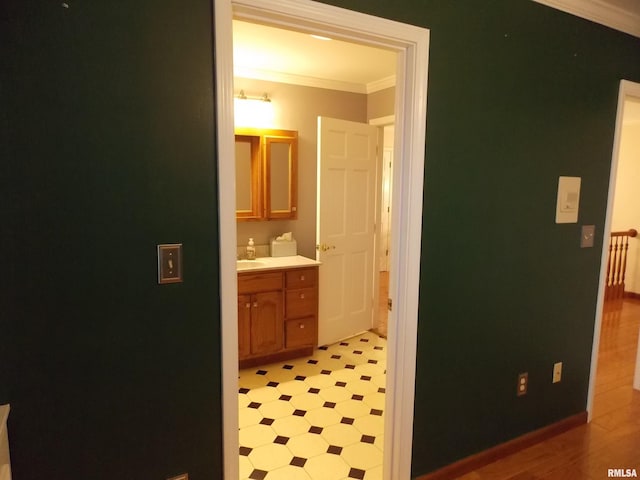 bathroom with vanity and crown molding