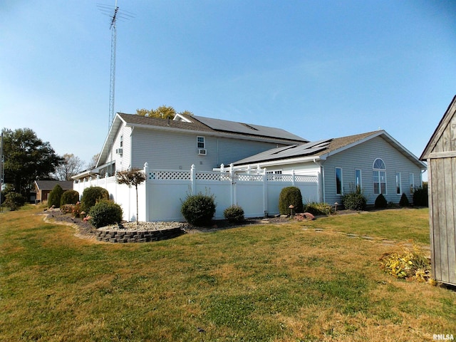 view of side of property with a yard