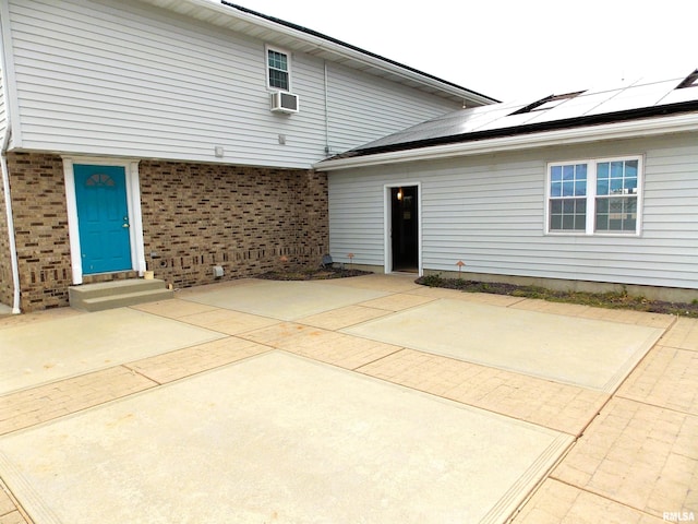 back of house featuring cooling unit and a patio area