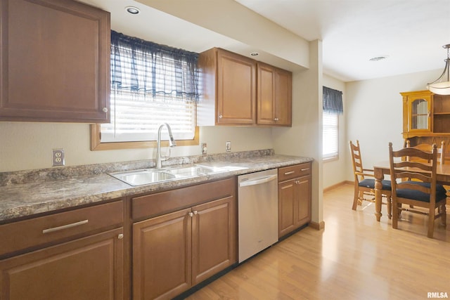 kitchen with light hardwood / wood-style flooring, dishwasher, a healthy amount of sunlight, and sink