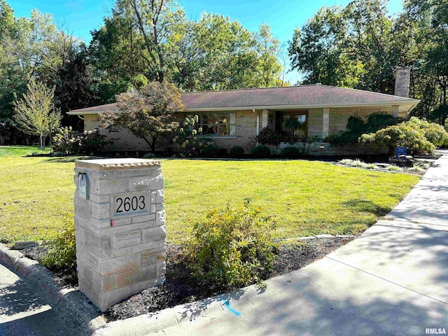 ranch-style house with a front yard