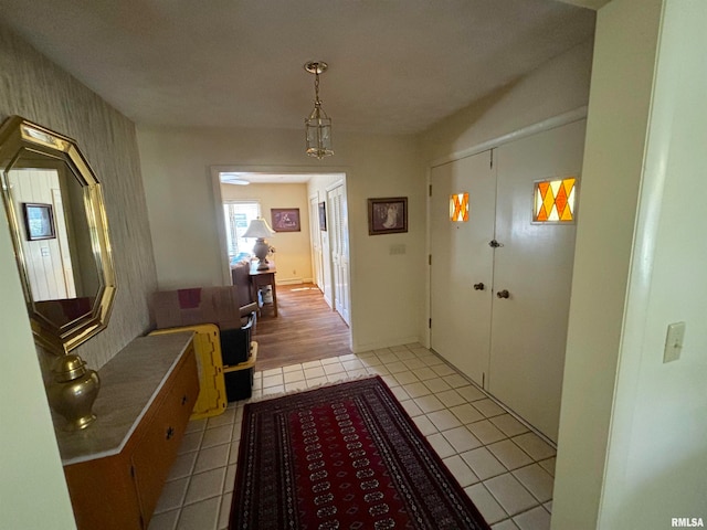 corridor with light hardwood / wood-style floors