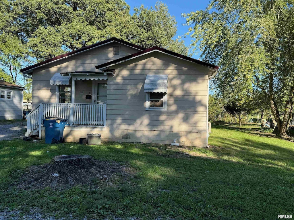 bungalow with a front yard