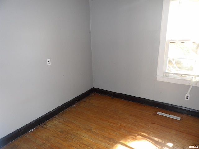 empty room with wood-type flooring