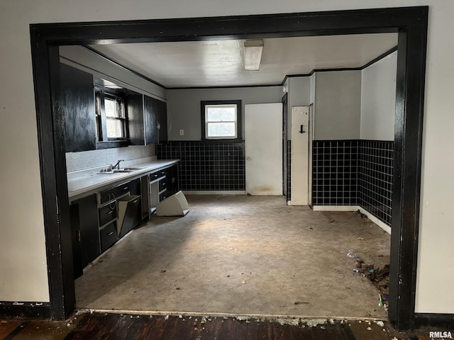 bathroom featuring vanity and tile walls