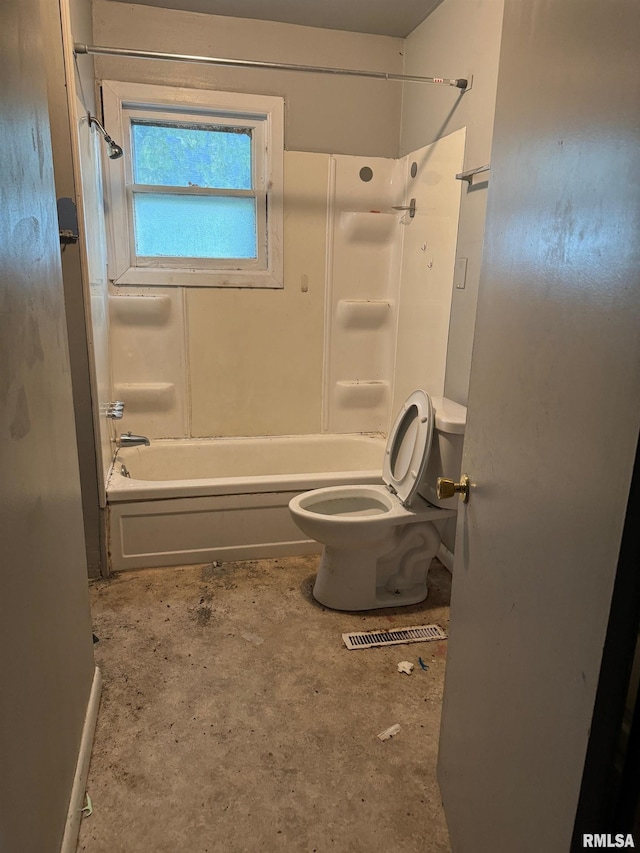 bathroom featuring toilet and bathing tub / shower combination