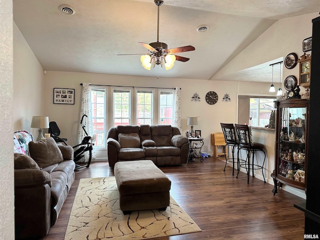 104 Townhouse Dr, Cambria, IL 62915 - living room with a ceiling fan, dark wood-style flooring, lofted ceiling, and a healthy amount of sunlight