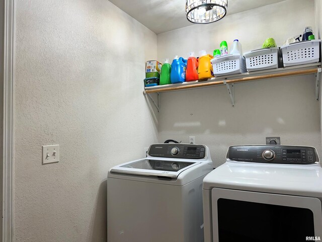 104 Townhouse Dr, Cambria, IL 62915 - clothes washing area featuring separate washer and dryer, laundry area, a notable chandelier, and a textured wall
