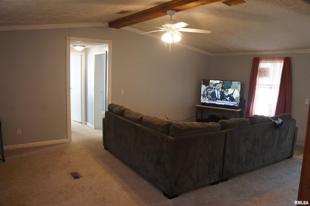 living room with vaulted ceiling with beams, a textured ceiling, ceiling fan, crown molding, and light colored carpet