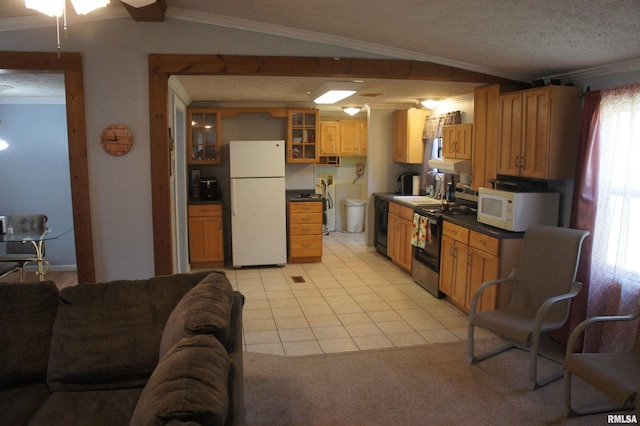 kitchen with white appliances, a textured ceiling, vaulted ceiling, and ornamental molding