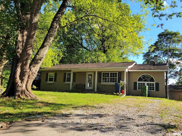 ranch-style home with a front yard