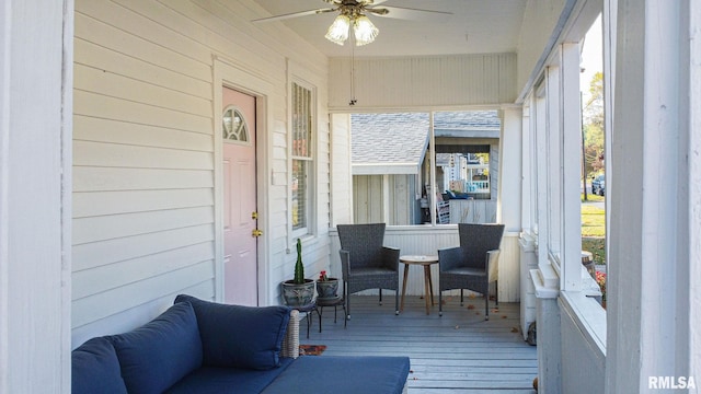 sunroom / solarium with ceiling fan and a healthy amount of sunlight