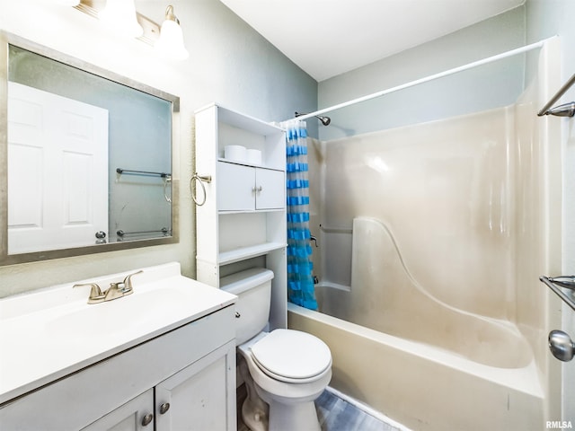 full bathroom featuring vanity, hardwood / wood-style floors, shower / tub combo with curtain, and toilet