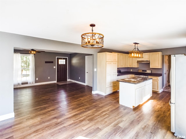 kitchen with hardwood / wood-style floors, stainless steel range with electric stovetop, decorative light fixtures, white fridge, and a center island