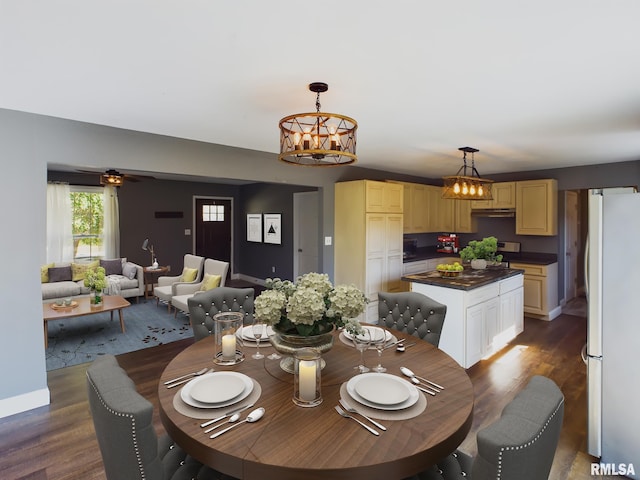 dining room with ceiling fan with notable chandelier and hardwood / wood-style floors