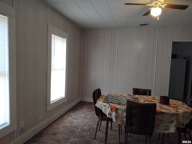 dining area featuring ceiling fan, carpet flooring, and plenty of natural light