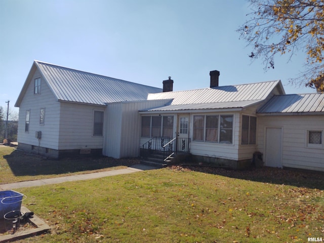 7280 Buncombe Rd, Buncombe, IL 62912 - back of property with a lawn, a chimney, and metal roof