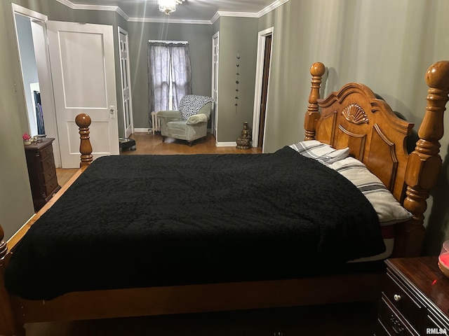 bedroom featuring ornamental molding and light hardwood / wood-style flooring